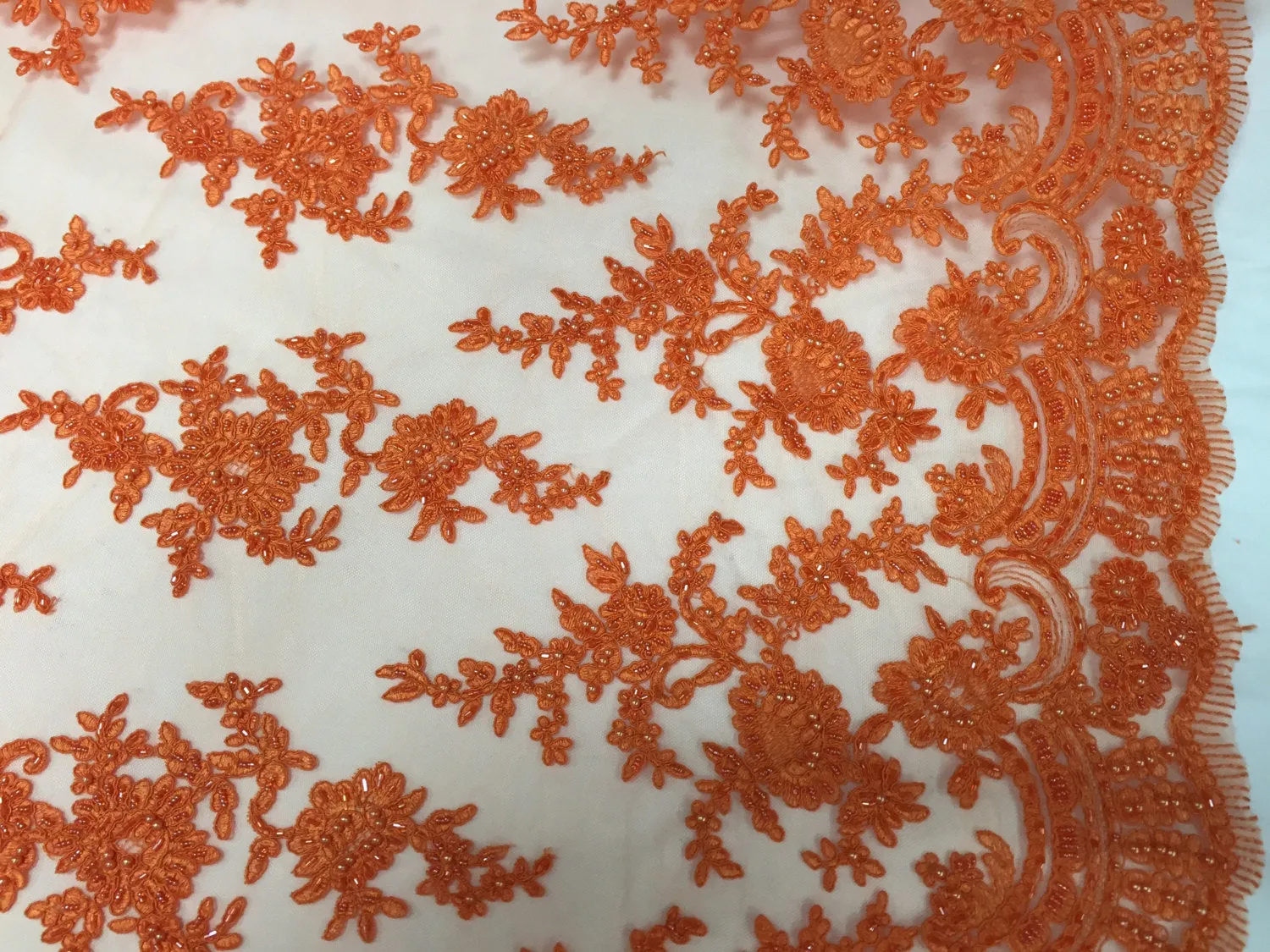 Orange appealing flower design embroider and beaded on a mesh lace-yard